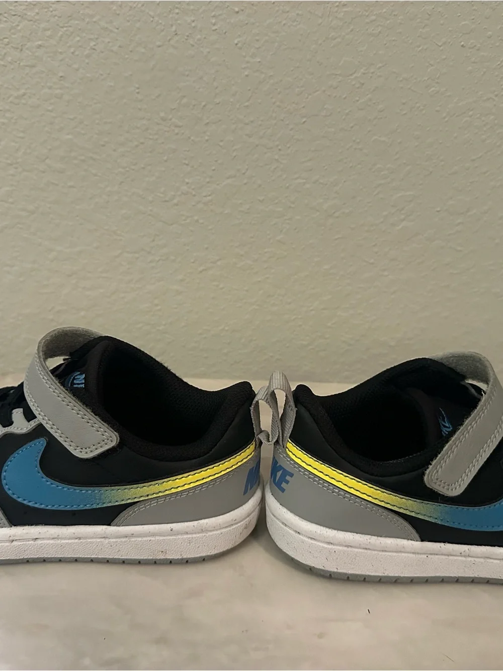 Nike Kids Gray and Black Sneakers with Blue Accent